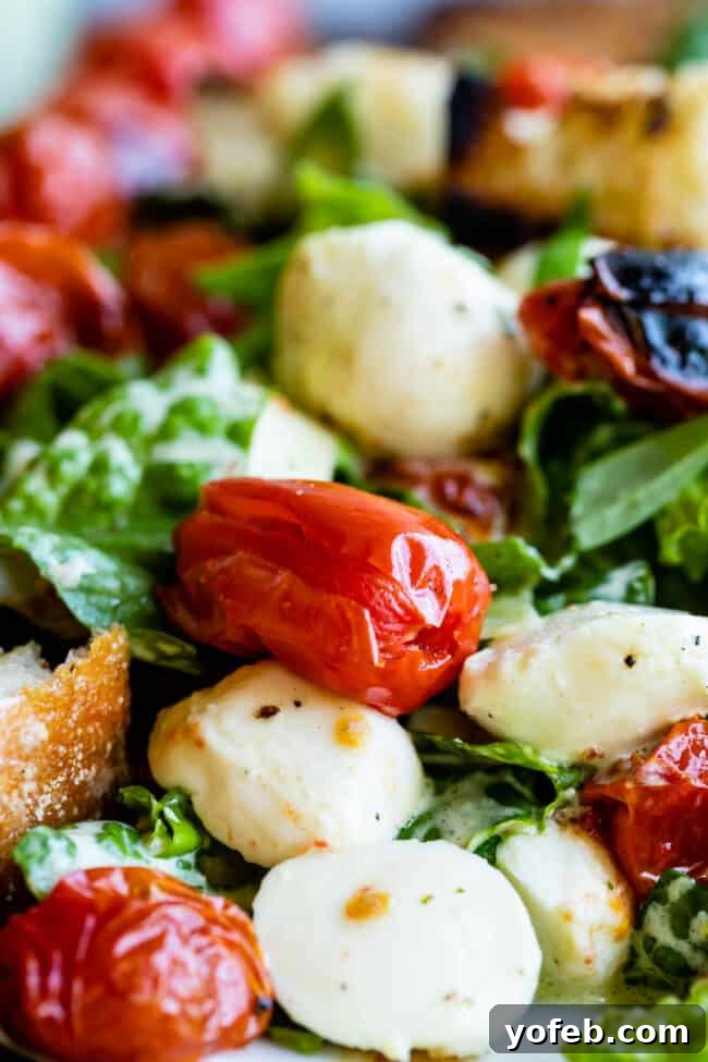 The Freshness Factor: Growing and Using Basil in Your Kitchen Grilled Caprese Salad with basil, tomatoes, and mozzarella on a wooden board