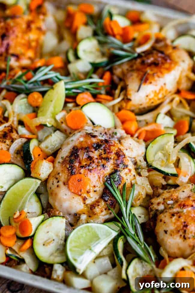 Sheet Pan Rosemary Lime Chicken and Veggies Vibrant sheet pan chicken and veggies, glistening with olive oil and spices, ready for the oven.