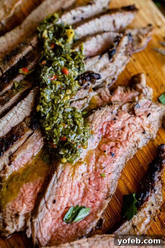 How to Cook Flank Steak (Grilled or Oven Broiled) Expertly grilled and thinly sliced flank steak, drizzled with fresh chimichurri sauce.