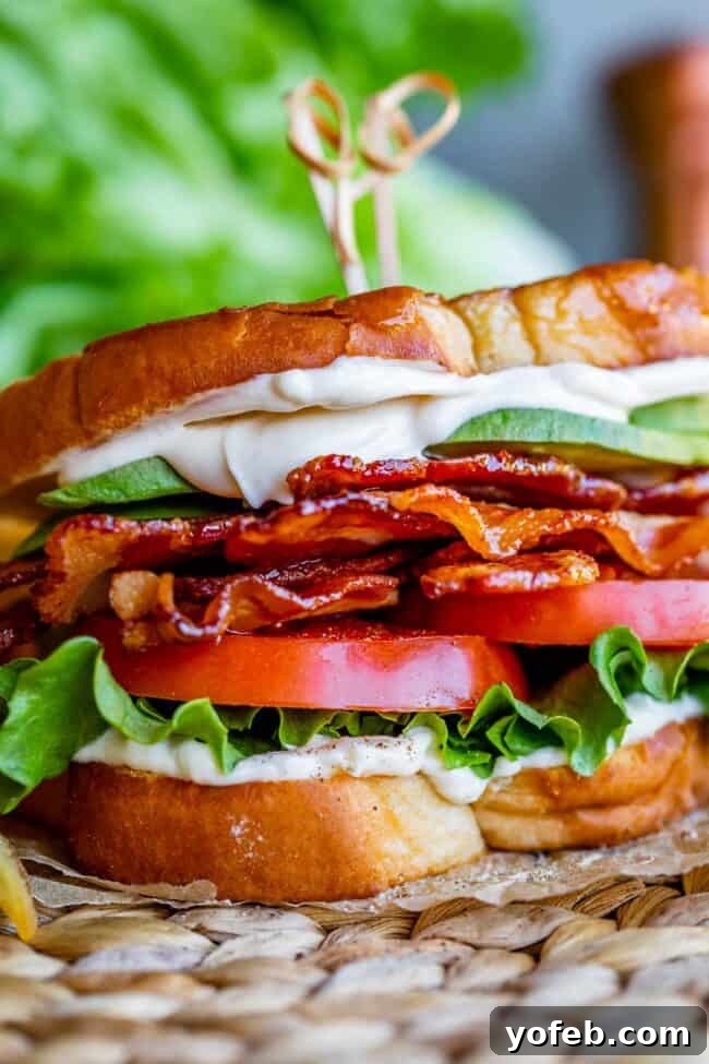 Crafting the Flawless BLT 15 blt sandwich on parchment paper with toothpicks holding it together