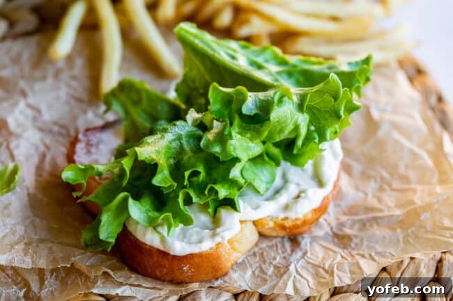 Crafting the Flawless BLT 8 green leaf lettuce on bread with mayonnaise on paper with fries