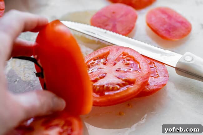 Crafting the Flawless BLT 9 slicing a tomato with a serrated knife