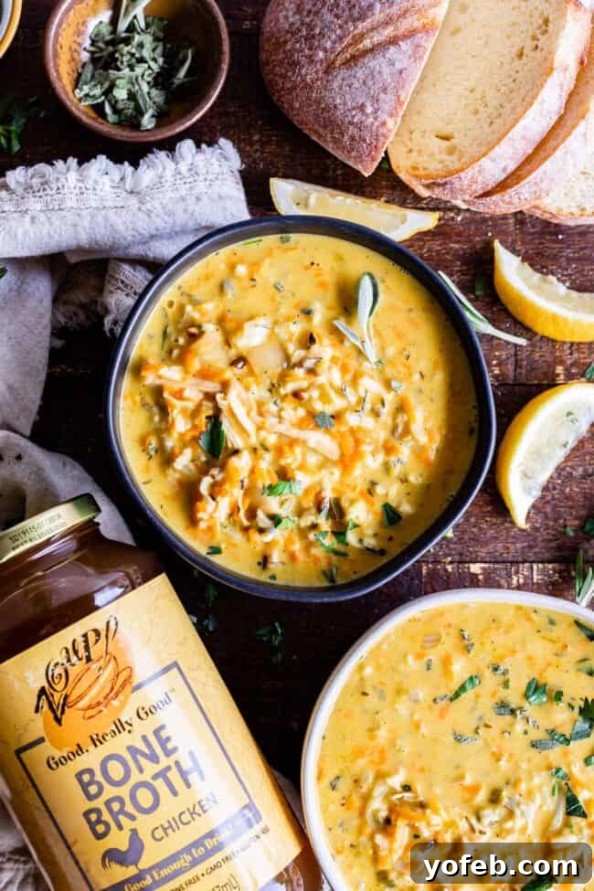 Creamy Turkey Wild Rice Soup served with bread, a perfect hearty meal. A beautifully presented bowl of creamy turkey soup, served alongside slices of crusty bread and a napkin, suggesting a complete and satisfying meal.