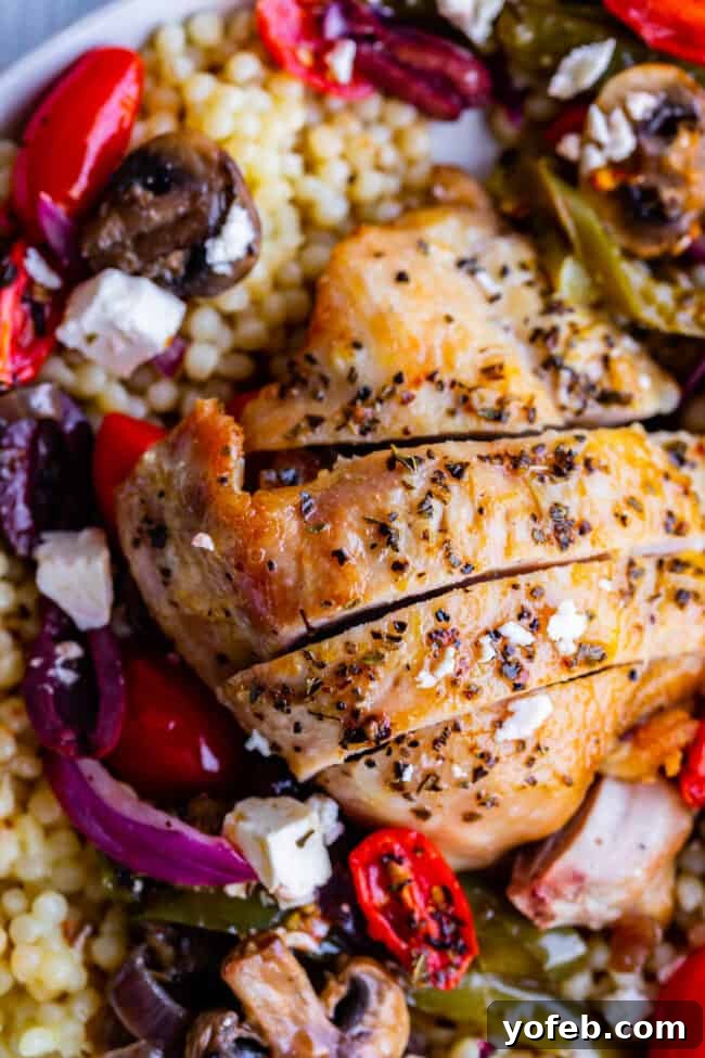 One-Pan Zesty Greek Chicken and Roasted Vegetables 4 A large skillet featuring the vibrant mix of Greek chicken, mushrooms, bell peppers, and red onions after sautéing, before adding cherry tomatoes and baking.