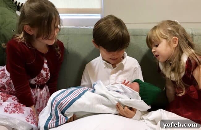 The Food Charlatan's 2019 Recipe Highlights 4 Edison's older siblings lovingly gazing at him in the hospital nursery.
