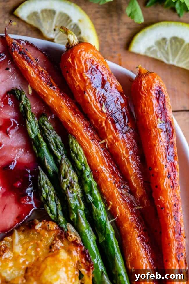 Quick and easy sheet pan dinner for Easter, Christmas, or Thanksgiving Delicious sheet pan Easter dinner with Raspberry Chipotle Ham and Roasted Veggies