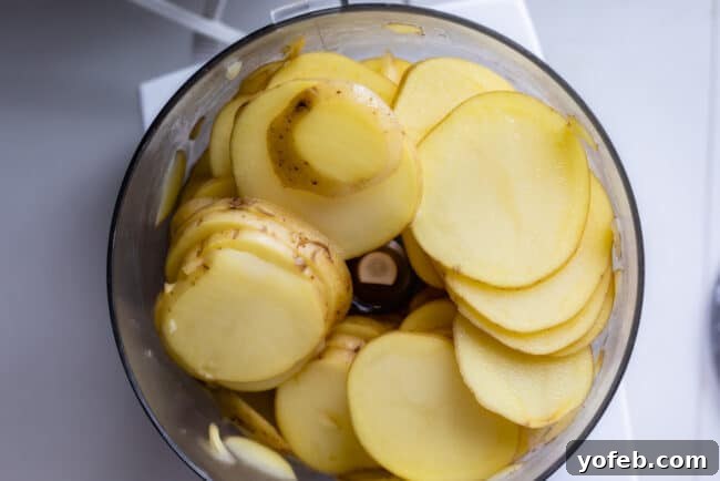 Perfectly thin potato slices for a crispy, cheesy au gratin on a sheet pan Thinly sliced potatoes for Gruyere Crisped Potatoes Au Gratin