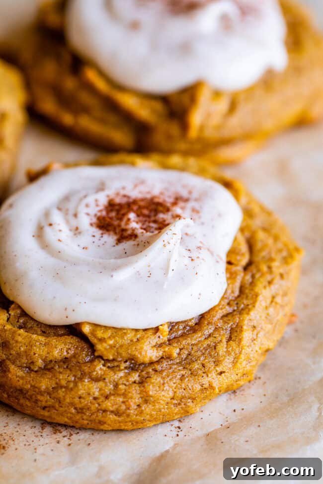 Simple and delicious pumpkin cookies, featuring a soft texture and an exquisite brown butter glaze. A plate of freshly baked pumpkin cookies, glazed with brown butter icing and ready to enjoy