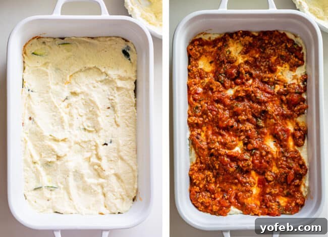 A white casserole dish showing a layer of creamy ricotta cheese spread over zucchini noodles, followed by a layer of rich marinara sauce on top. This image illustrates the second main step in assembling a low-carb zucchini lasagna, building the flavors and textures layer by layer.