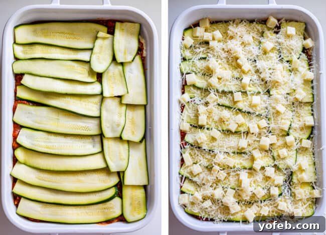 The top layer of zucchini noodles in a pan, generously topped with an even sprinkle of mozzarella and Parmesan cheeses, ready for baking. This final assembly shot promises a golden, bubbly crust for the zucchini lasagna.