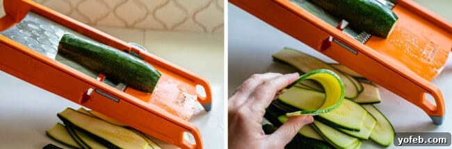 Zucchini being sliced thinly on a mandoline, with a hand gently bending a slice to demonstrate its flexibility without snapping.