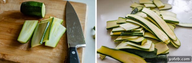 Thinly sliced zucchini strips, resembling pasta noodles, neatly arranged on a cutting board, ready for the next step in preparing zucchini lasagna. This image highlights the precise cutting required for a non-watery and delicious low-carb meal.