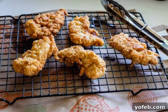 Fried Chicken Resting Freshly fried chicken cooling on a wire rack