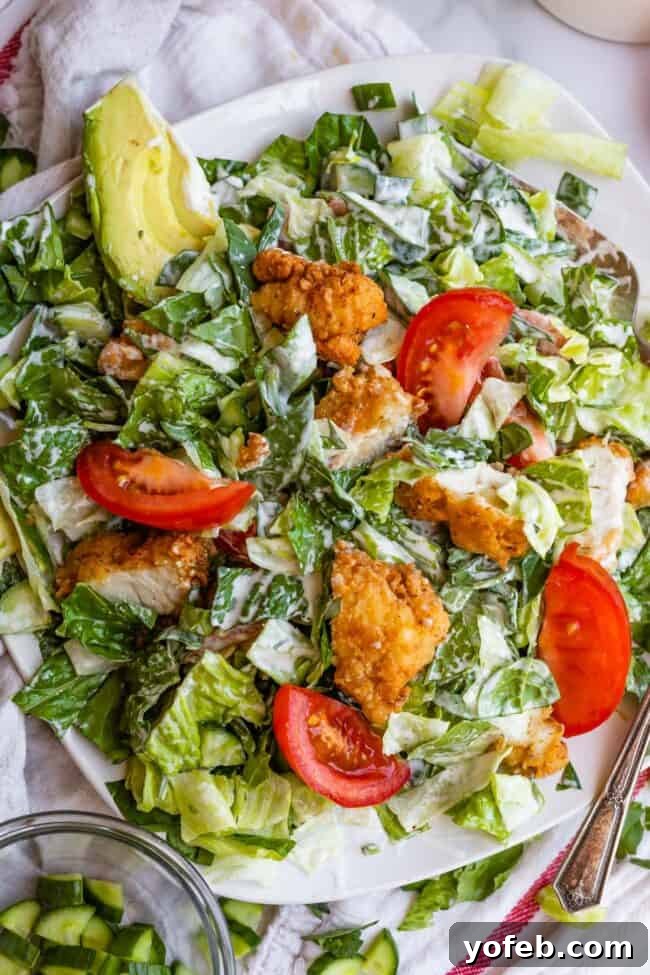 Mixed Crispy Chicken Salad Crispy chicken salad mixed with ranch dressing on a plate