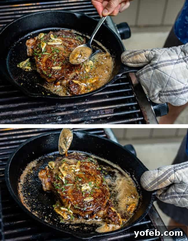 A beautifully pan-fried ribeye steak, richly basted with aromatic garlic butter, glistening with flavor.