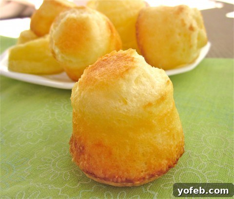 IMG_3219 Close-up of golden-brown Brazilian cheese breads, showcasing their inviting texture and color.