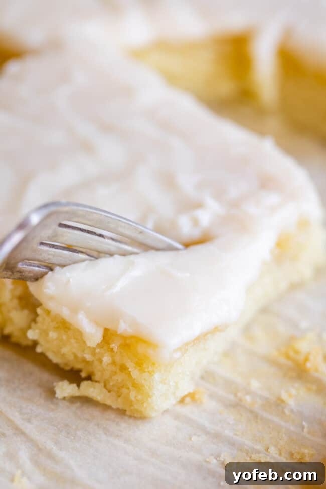 Simple White Texas Sheet Cake Cooling Easy-to-make white Texas sheet cake cooling on a wire rack