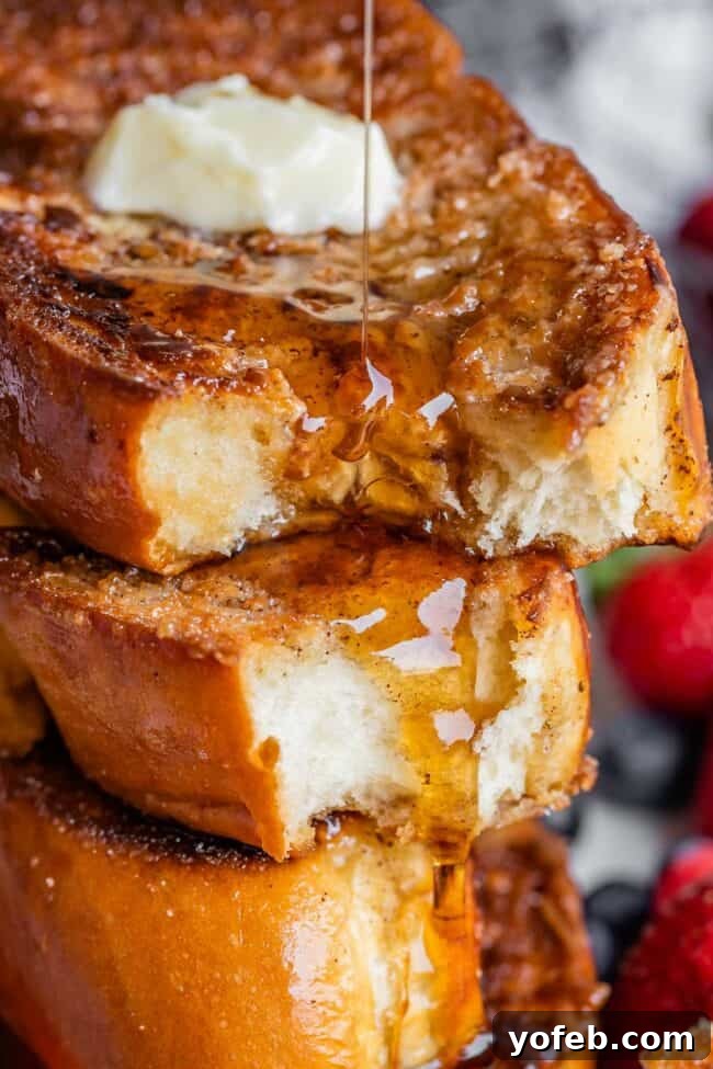 Golden Glazed French Toast 2 Thick sliced challah French toast drizzled with maple syrup, garnished with fresh berries.