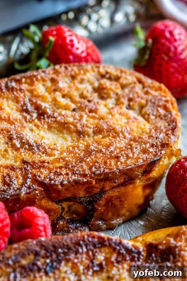 Golden Glazed French Toast 12 Close-up of the caramelized edge of fluffy French toast, showcasing its sugary crunch.
