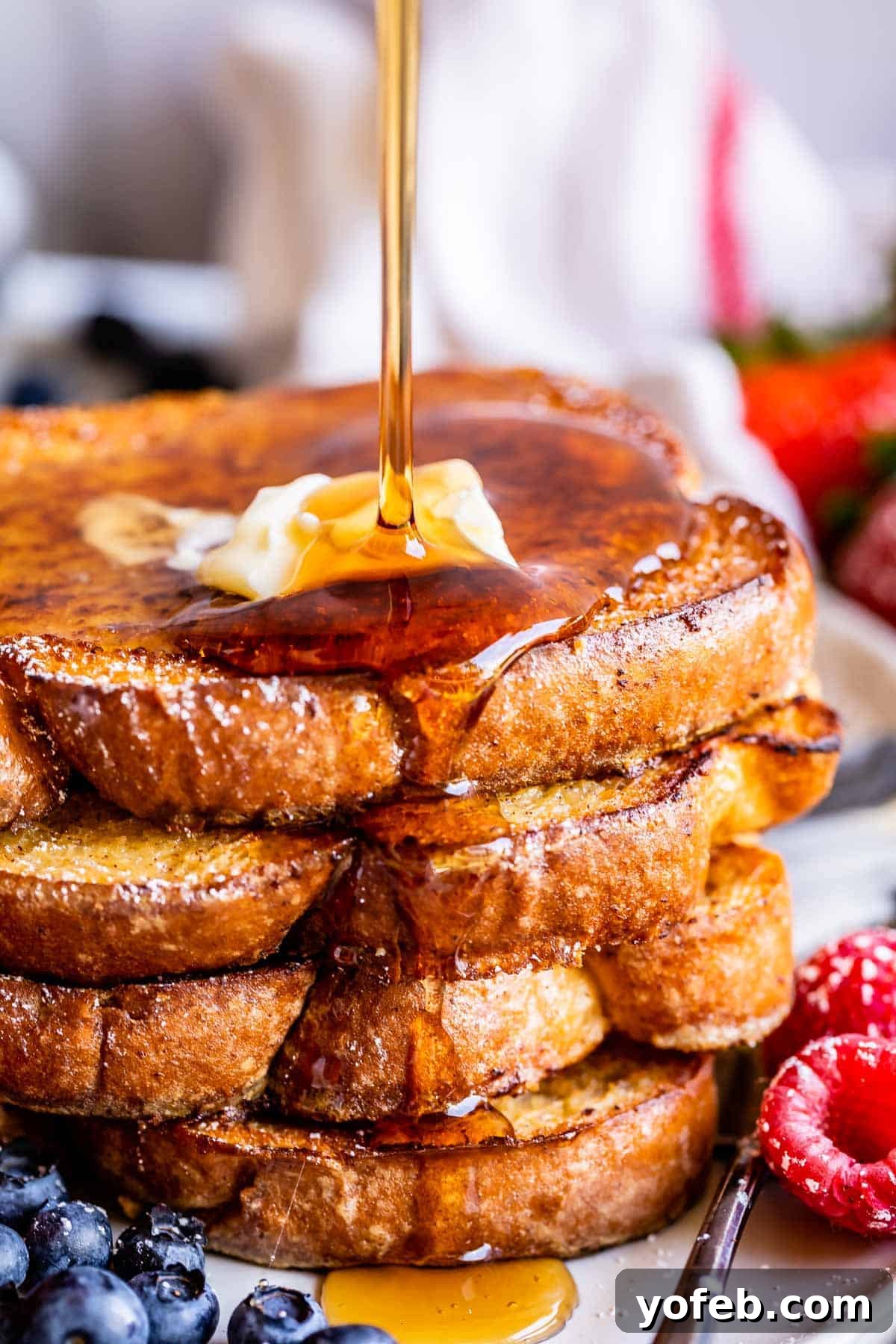 Golden Glazed French Toast 19 French toast recipe, stacked with a syrup drizzle