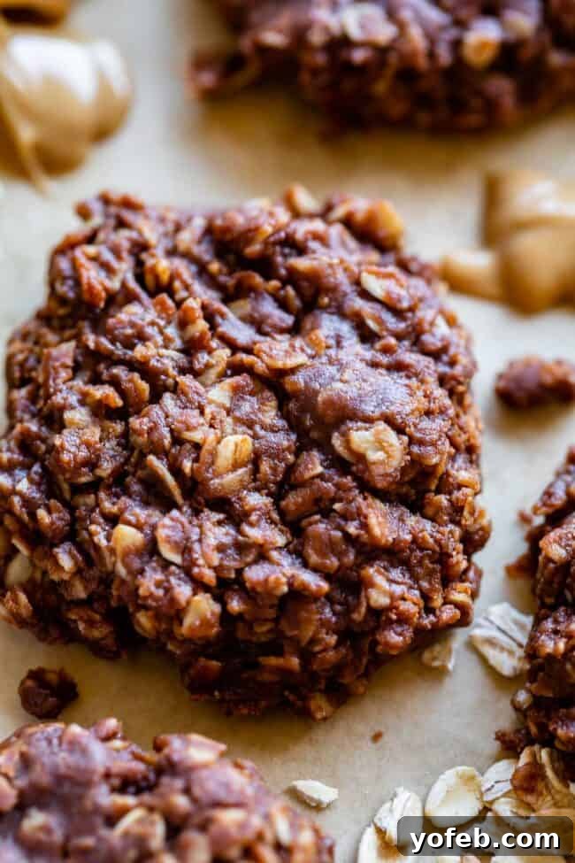 Easy No-Bake Peanut Butter Oatmeal Cookies 7 no bake peanut butter oatmeal cookies with oats on a sheet of parchment paper