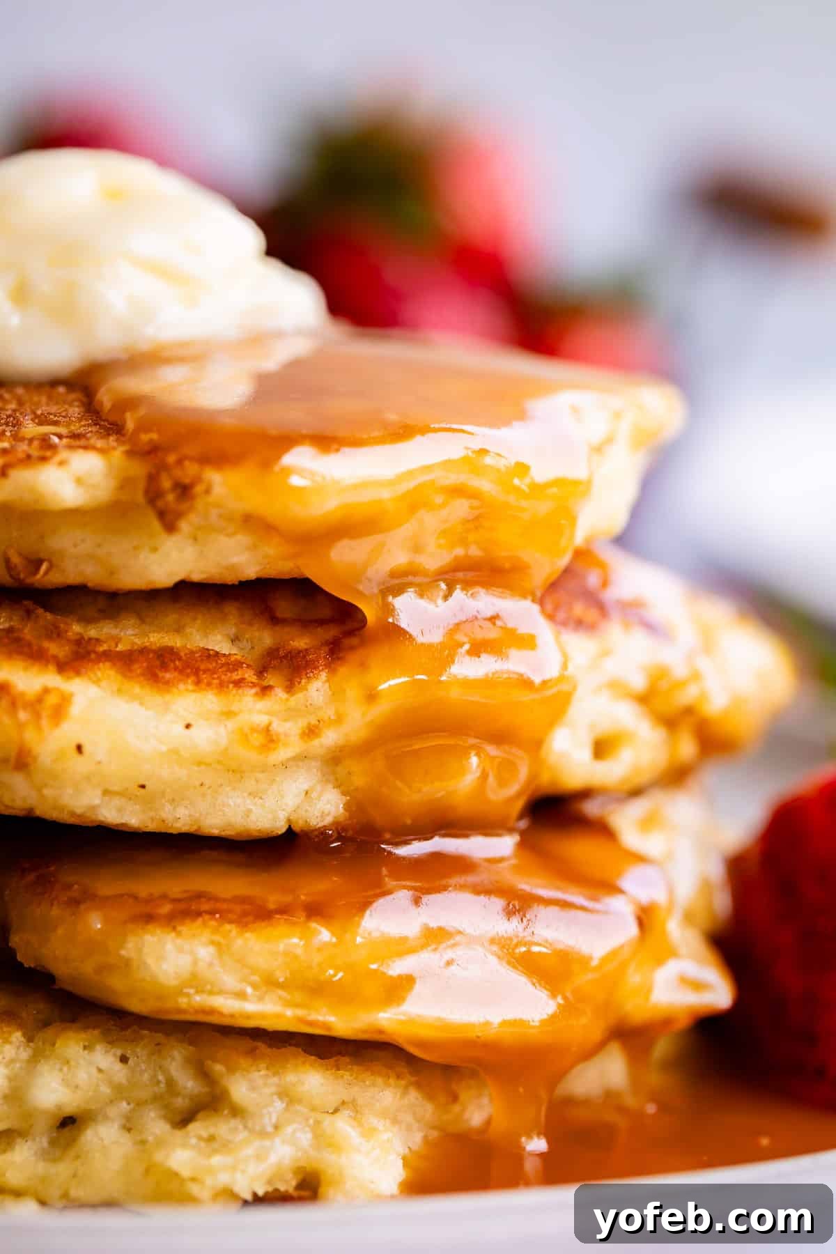 Velvet Smooth Buttermilk Syrup 17 buttermilk syrup recipe drizzled over pancakes with butter.
