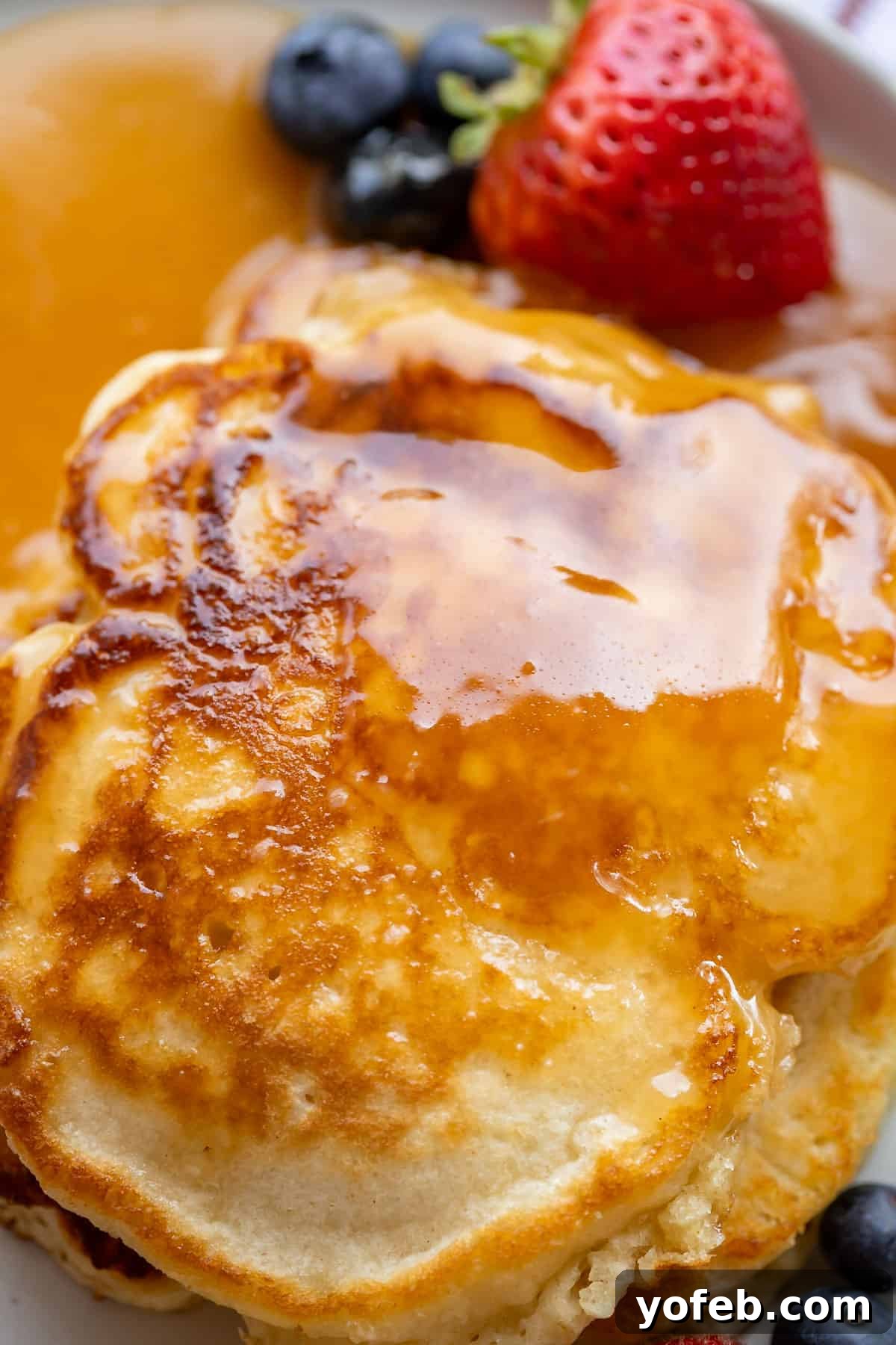 Velvet Smooth Buttermilk Syrup 4 overhead shot of buttermilk syrup recipe on a plate with fruit.