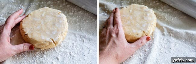 A hand gently molding cracked pie dough back together with fingers, a technique to repair edges during rolling.
