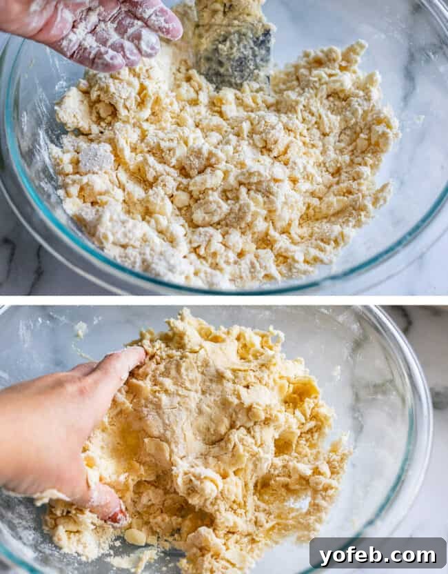 The process of mixing shaggy pie dough in a glass bowl, first with a spatula and then pressing it together with hands to form a cohesive ball.
