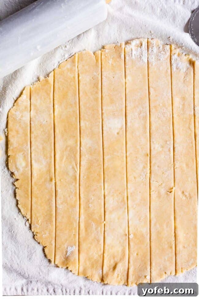 pie dough rolled out and cut into strips for lattice pie crust