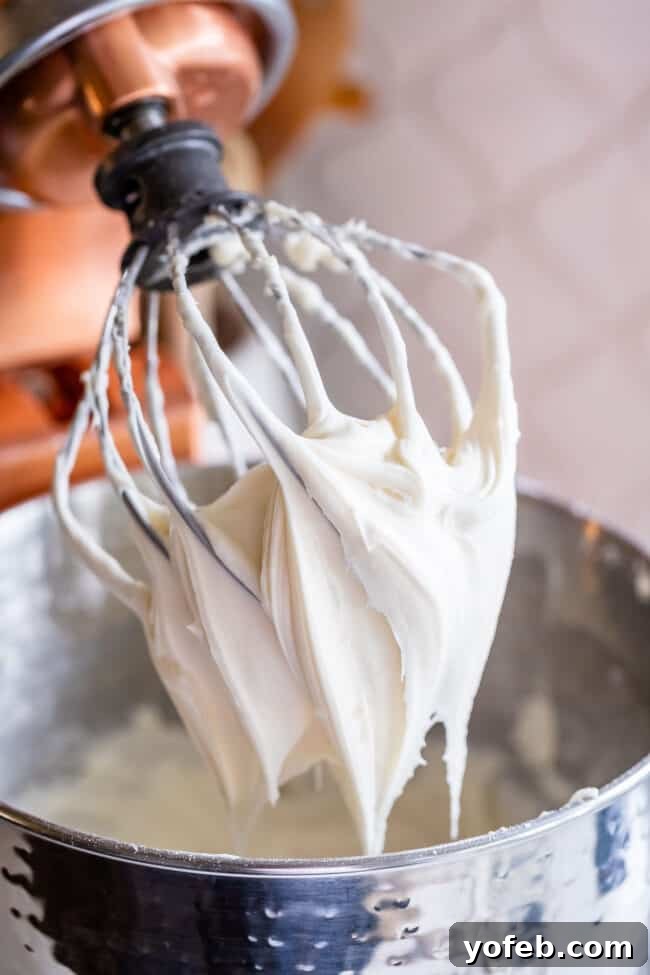 The Ultimate Cream Cheese Frosting 9 Perfectly whipped cream cheese frosting on a balloon beater attachment.