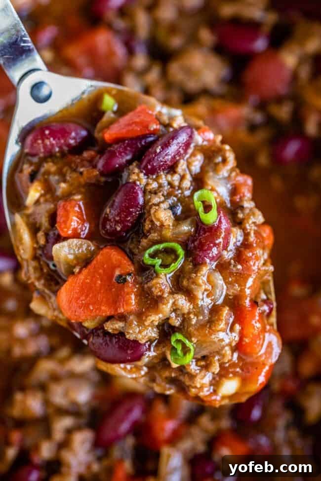 Effortless 45 Minute Chili 13 meaty chili recipe on a spoon.