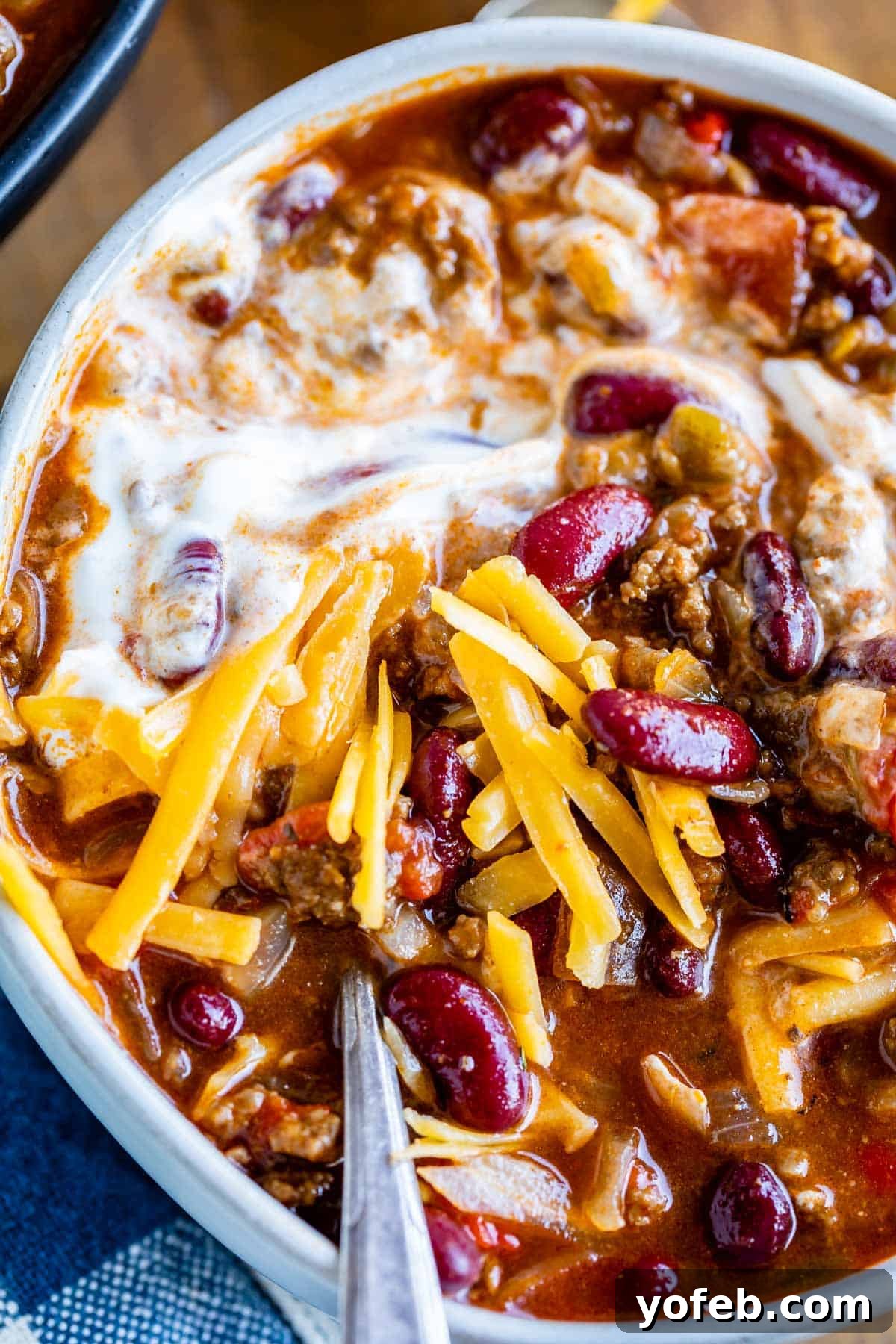 easy homemade chili in a bowl with a spoon and garnishes