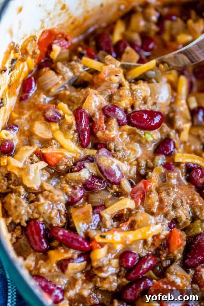 Effortless 45 Minute Chili 3 quick chili recipe in a pot mixed with cheese and sour cream.