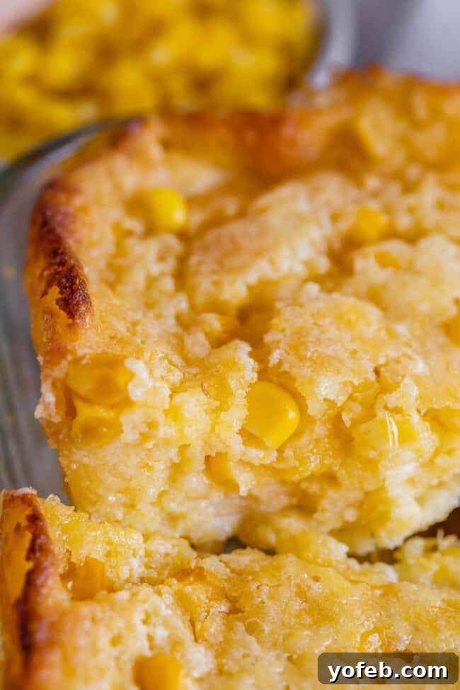 Golden Cornbread Delight 15 jiffy cornbread casserole recipe being lifted from the pan.