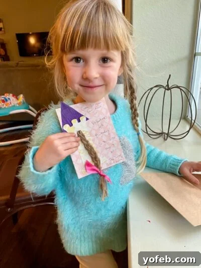 Foolproof Rice Krispies Treats 5 Daughter holding homemade Rapunzel birthday card made with twine.