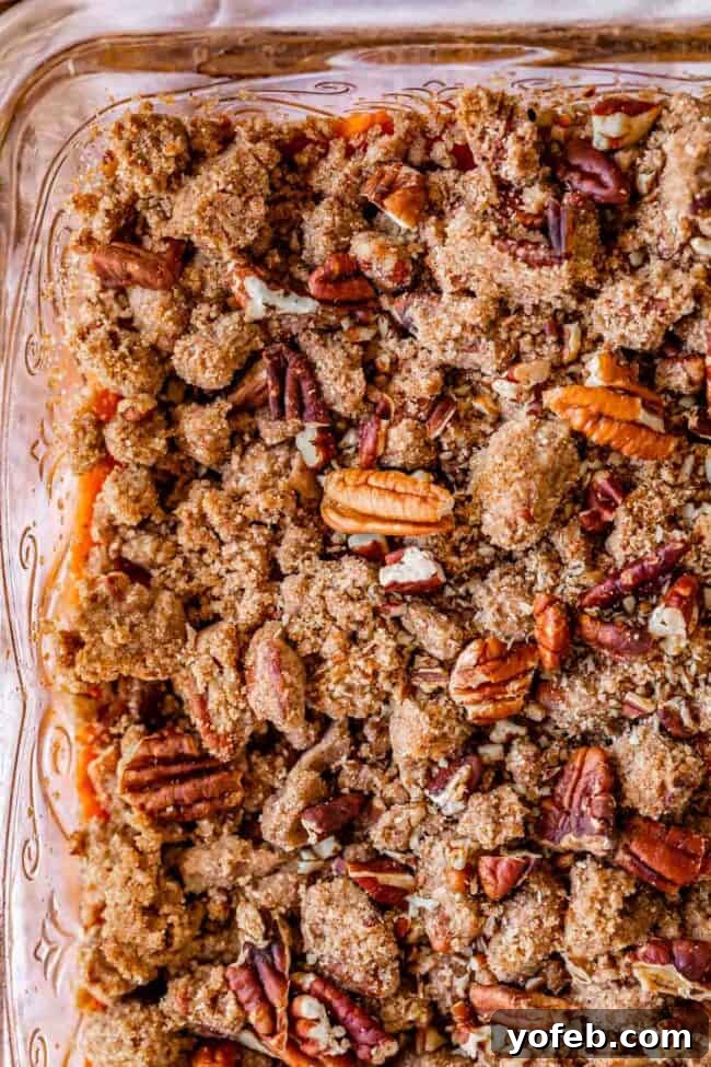 Heavenly Sweet Potato Crumble 5 An overhead shot of the streusel topping generously spread over a sweet potato casserole, highlighting the nutty texture.