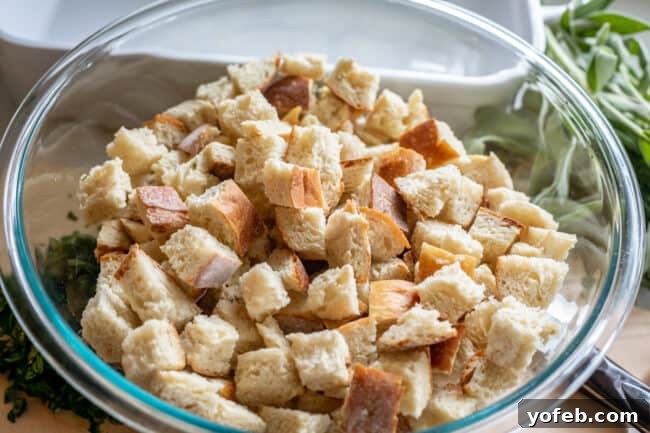 The Ultimate Thanksgiving Stuffing 11 cubed toasted bread in a large glass bowl