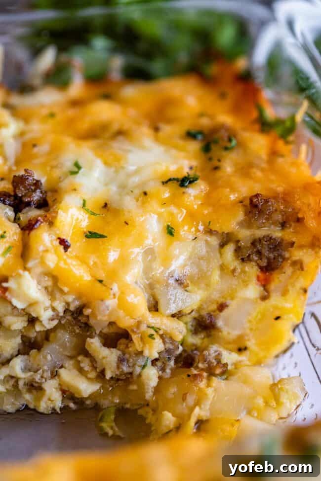 The Ultimate Sausage Breakfast Casserole 13 sausage egg breakfast casserole cross section in a pan.