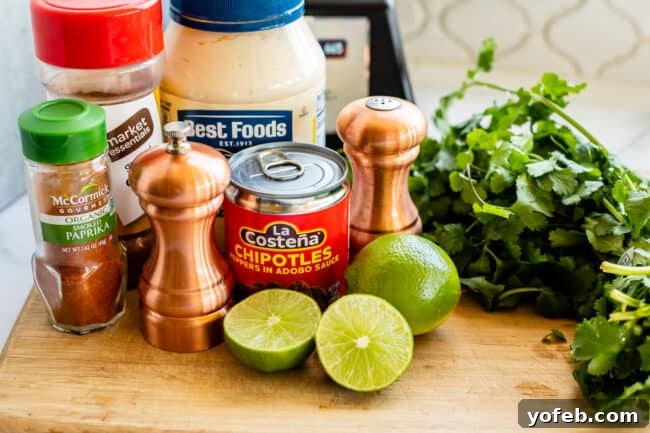 Whip Up Your Own Smoky Chipotle Sauce 6 Ingredients laid out for chipotle mayo: lime, fresh cilantro, salt, black pepper, smoked paprika, a jar of mayonnaise, canned chipotle chilies, and ground cumin.