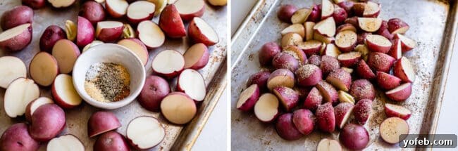 Crispy Oven-Roasted Red Potatoes 9 bowl of mixed spices being sprinkled over chopped red potatoes on a baking sheet, preparing for seasoning