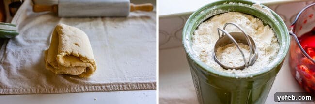 Dough rolled out and folded in quarters, next to a canister of flour with a biscuit cutter inside.
