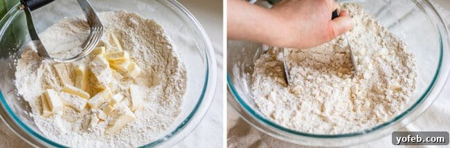 Cutting cold butter into flour mixture in a glass bowl with a pastry knife.