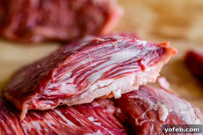 Mastering Carne Asada 10 cross section slice of outside skirt steak showing fat pockets.