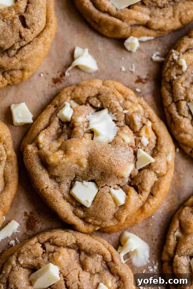 Dreamy White Chocolate Chip Treats 5 white chocolate chip cookies with crumbled white chocolate on pan