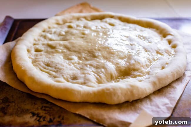 The Ultimate Homemade Pizza Ready When You Are 16 Par-baked pizza dough, lightly puffed and brushed with olive oil, ready for toppings.