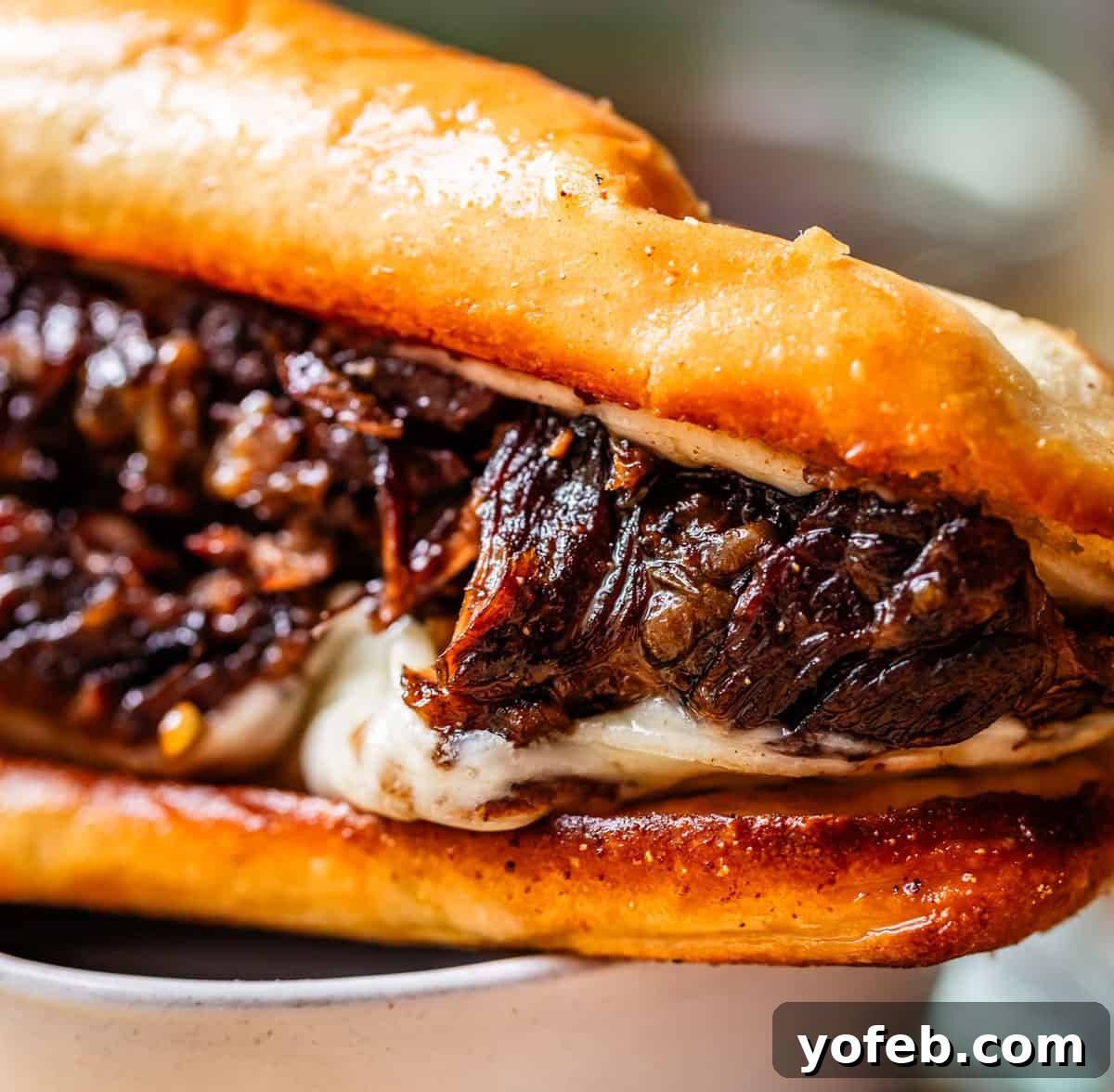 Ultimate Slow Cooker French Dip Sandwiches 23 A French Dip sandwich piled high with tender chuck roast and provolone cheese, perfectly toasted and ready to dip.