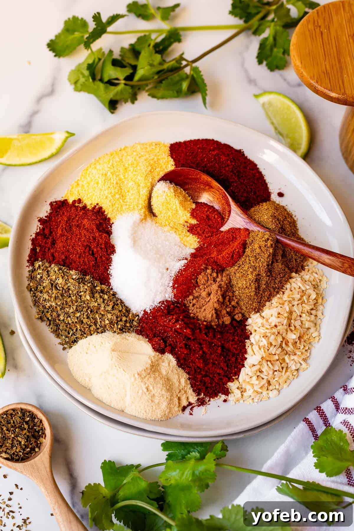 Elevate Your Tacos with Homemade Seasoning 3 Assortment of spices for DIY taco seasoning laid out on a plate, ready for mixing.
