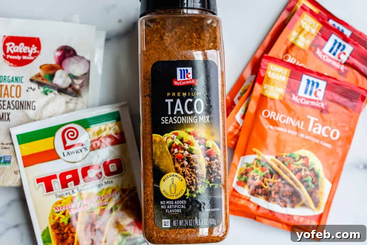 Elevate Your Tacos with Homemade Seasoning 5 A comparison of several brands of pre-made taco seasoning in their original packaging, displayed on a kitchen counter.