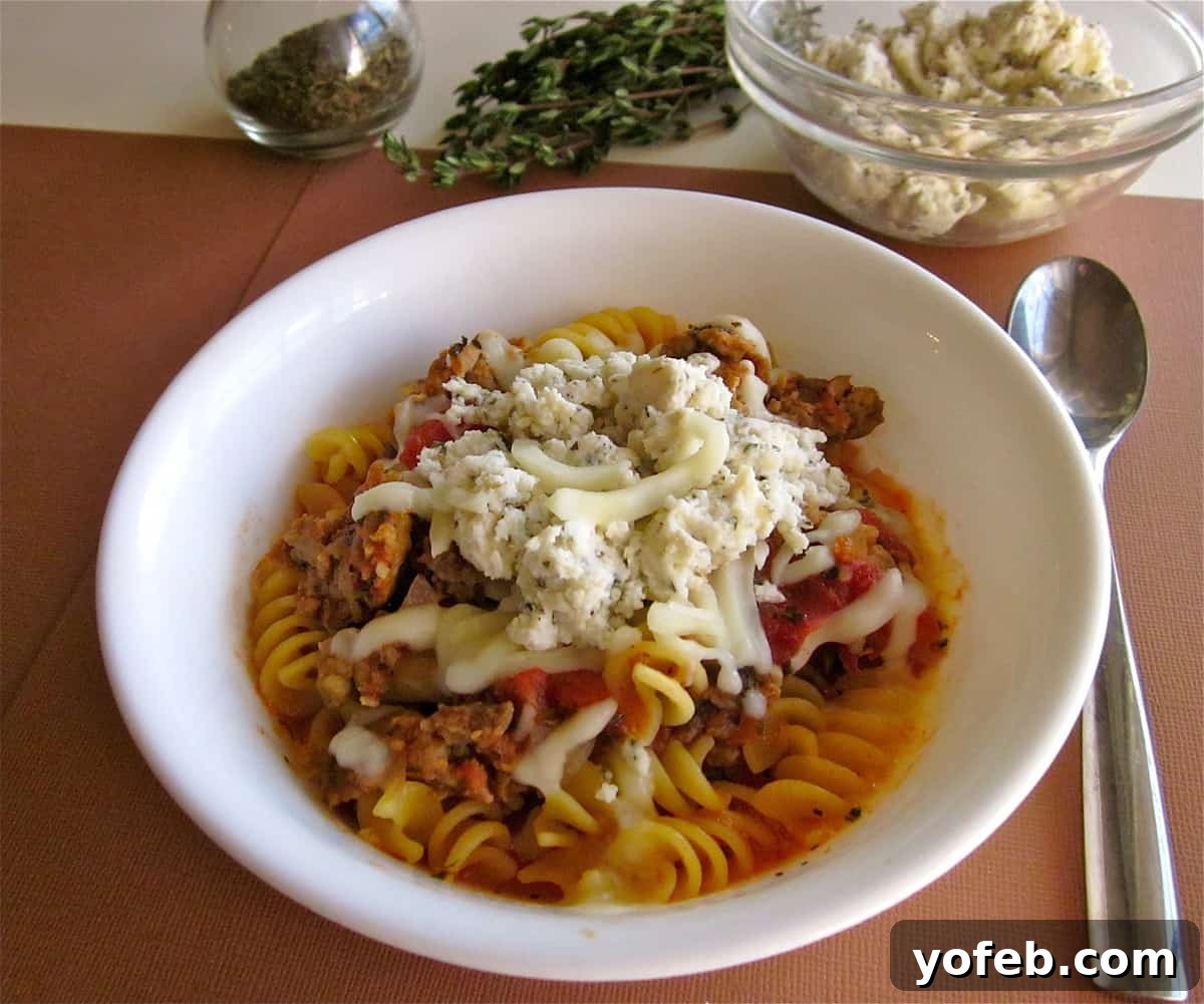 IMG_1296 An older photo of lasagna soup in a white bowl, resting on a brown table, characteristic of early food blog aesthetics.